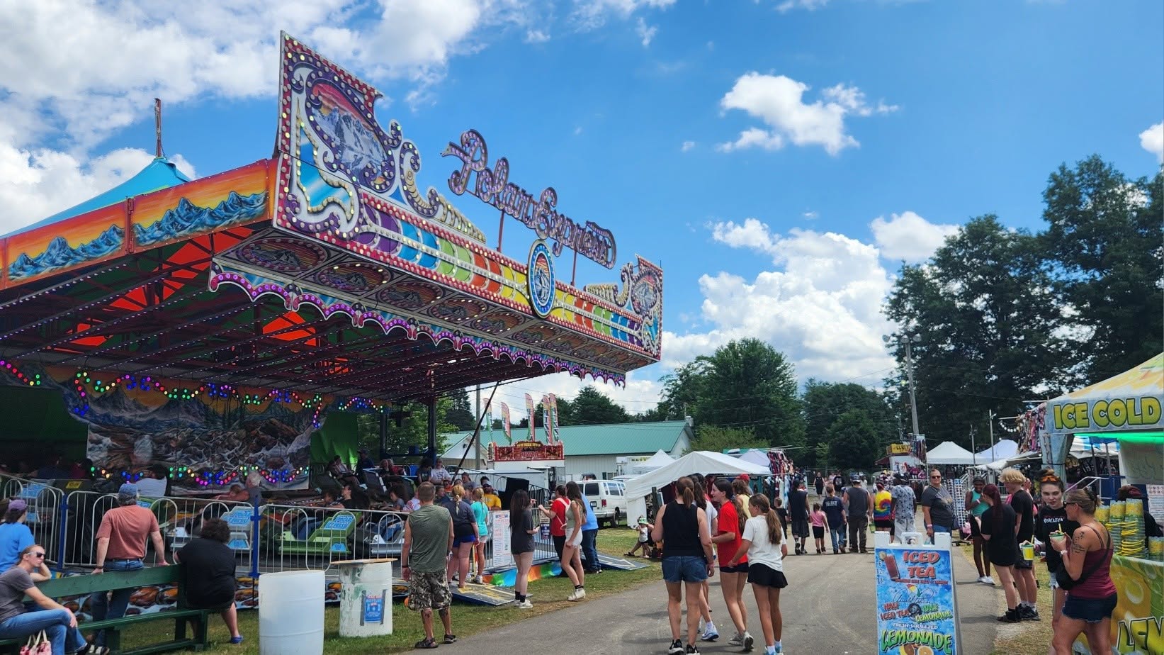 Community members gathering at a county fair